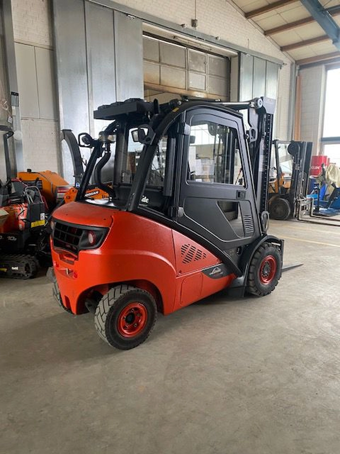 mobil s&s GmbH - Maschinenbau - Orangefarbener Bagger Doosan DX10Z